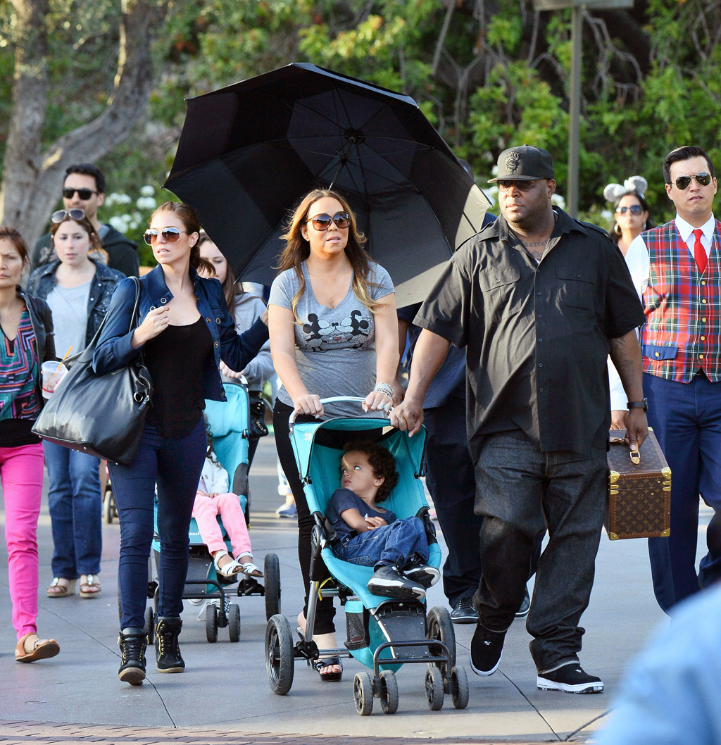 Photo © 2015 Splash News/The Grosby Group EXCLUSIVE Anaheim, May 19 2015 Mariah Carey spent the day at Disneyland and California Adventure with her two children Moroccan Cannon and Monroe Cannon at the happiest place on earth and brought along a very large entourage that included two nannies, four bodyguards, three disneyland VIP tour guides and a woman who acted as her umbrella carrier the entire day. The lady with the umbrella walked behind and around Mariah the entire day covering her from the sun. even as mariah rode rides this woman was always nearby. Mariah and her children enjoyed many rides throughout the day including toy story mania, a carousel, the dumbo ride, space mountain, the hollywood tower of terror and the star tours ride. Mariah also treated her children to a special lunch at Ariel's grotto where they were greeted by many of the characters fro the park including Ariel herself.