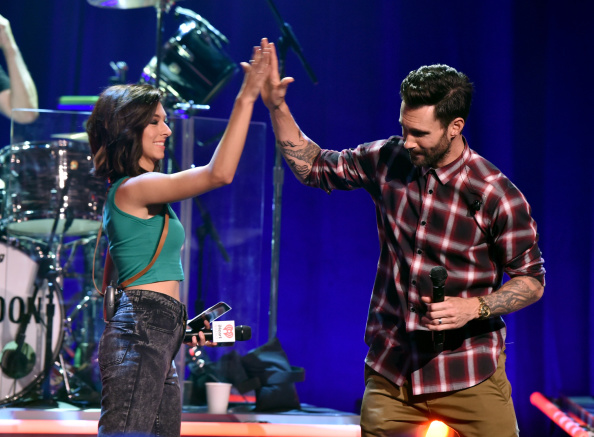 BURBANK, CA - AUGUST 26: Singers Christina Grimmie (L) and Adam Levine speak onstage druing the iHeartRadio Album Release Party with Maroon 5 LIVE on the CW at iHeartRadio Theater on August 26, 2014 in Burbank, California. (Photo by Kevin Winter/Getty Images for Clear Channel)