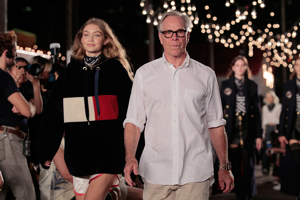 NEW YORK, NY - SEPTEMBER 09:  Model Gigi Hadid (L) and designer Tommy Hilfiger walk the runway at #TOMMYNOW Women's Fashion Show during New York Fashion Week at Pier 16 on September 9, 2016 in New York City.  (Photo by Randy Brooke/Getty Images for Tommy Hilfiger)