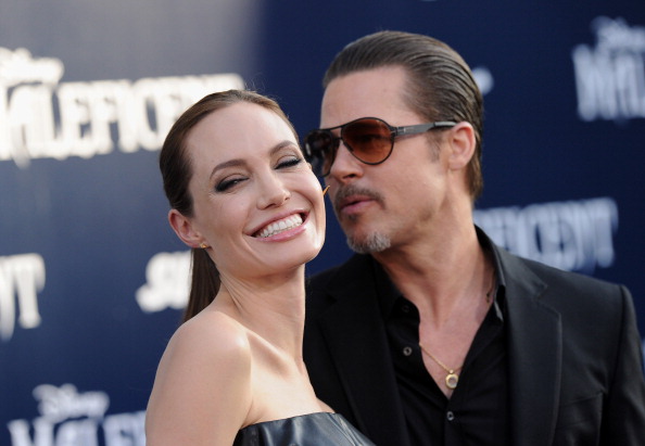 HOLLYWOOD, CA - MAY 28: Actors Angelina Jolie and Brad Pitt arrive at the World Premiere of Disney's 'Maleficent' at the El Capitan Theatre on May 28, 2014 in Hollywood, California. (Photo by Axelle/Bauer-Griffin/FilmMagic)