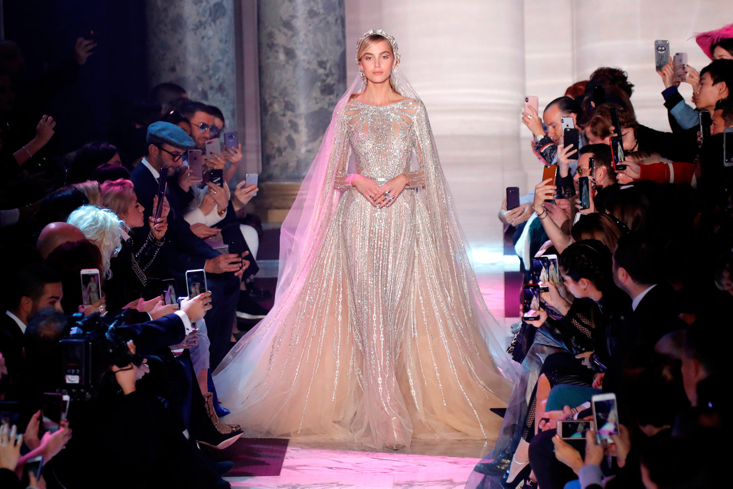 A model presents a wedding dress by designer Elie Saab as part of his Haute Couture Spring-Summer 2018 fashion show in Paris