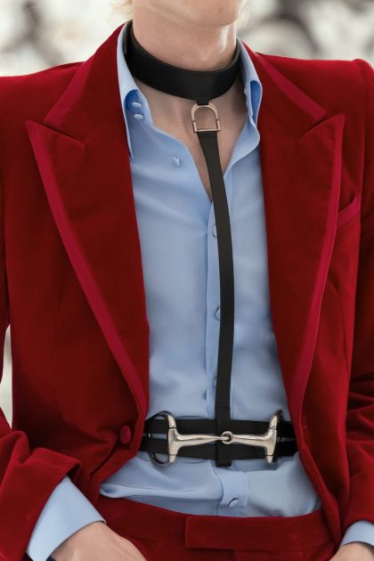 Gucci red suit and leather leash